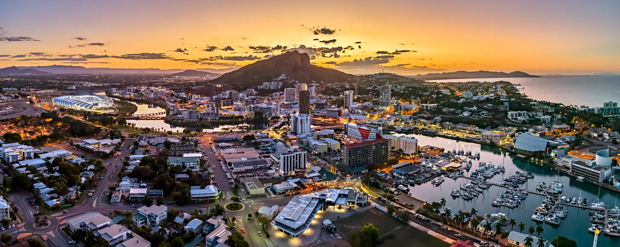 Townsville city, Castle Hill and the marina at dusk, seen from the air